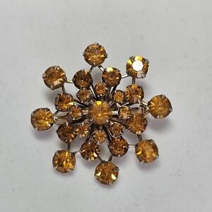 Elegant Gold-Tone Brooch with Amber Crystals
